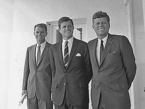 This Aug. 28, 1963 National Archives handout photo shows former U.S. president John F. Kennedy, right, and his brothers, former Attorney General and Senator Robert F. Kennedy, left, and Senator Edward Moore Kennedy, outside of the Oval Office at the White House, in Washington, D.C.