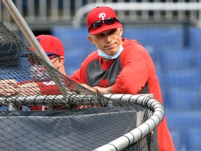 Manager Joe Girardi of the Philadelphia Phillies looks on during batting practice before a game against the Washington Nationals at Nationals Park on May 11, 2021 in Washington.