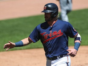 Twins baserunner Josh Donaldson crosses home plate to score the two millionth run in MLB history off an RBI double by Nelson Cruz against the Royals in the first inning of the game at Target Field in Minneapolis, Saturday, May 29, 2021.