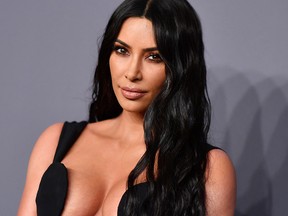 In this file photo taken on February 6, 2019, Kim Kardashian West arrives to attend the amfAR Gala New York.