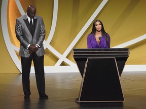 Vanessa Bryant, wife of the late Kobe Bryant with presenter Michael Jordan, speaks on his behalf during the Naismith Memorial Basketball Hall of Fame Enshrinement ceremony at Mohegan Sun Arena.