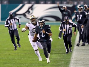 Defensive tackle Shy Tuttle of the New Orleans Saints chases after quarterback Jalen Hurts of the Philadelphia Eagles in the second quarter at Lincoln Financial Field on Dec. 13, 2020 in Philadelphia, Pa.