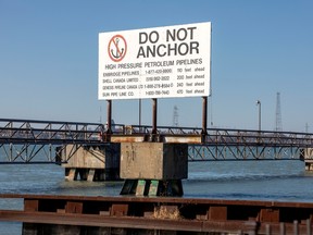 A signpost marks the presence of high pressure petroleum pipelines including Enbridge's Line 5 pipeline, in Sarnia, Ontario March 20, 2021.