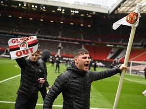 Supporters protest against Manchester United's owners, inside Old Trafford stadium in Manchester, on May 2, 2021, ahead of their English Premier League fixture against Liverpool.