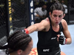 Marina Rodriguez, right, punches Michelle Waterson in a flyweight fight during the UFC Fight Night event at UFC APEX in Las Vegas, Saturday, May 8, 2021.