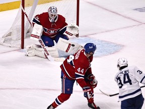 Montreal Canadiens goaltender Jake Allen makes a save against Maple Leafs' Auston Matthews as defenceman Joel Edmundson defends during the second period at Bell Centre on Monday, May 3, 2021.