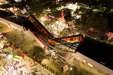 A general view of damage caused after a railway overpass and train collapsed onto a busy road in this drone picture obtained from social media Mexico City, Mexico May 4, 2021. Picture taken with a drone. INSTAGRAM @CSDRONES/via REUTERS