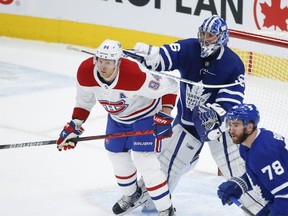 Montreal Canadiens Corey Perry and Toronto Maple Leafs Jack Campbell get into it in front of the net during first period action in Toronto on May 6, 2021.