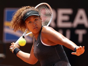 Naomi Osaka returns a forehand to Jessica Pegula during the Internazionali BNL d’Italia at Foro Italico on May 12, 2021 in Rome.