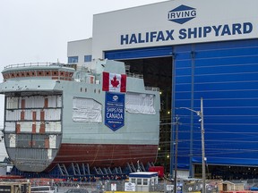 The centre block of the future HMCS Max Bernays is moved from the fabrication building to dockside at the Irving Shipbuilding facility in Halifax on Friday, Jan. 22, 2021.