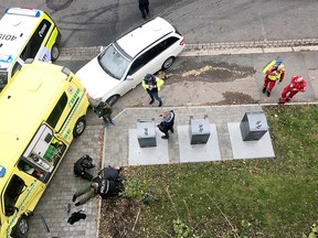 Police officers apprehend an armed man who stole an ambulance in Oslo, Norway, October 22, 2019.