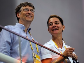 Microsoft Corp co-founder Bill Gates (L) and his wife Melinda Gates watch the swimming events at the National Aquatics Center during the Beijing 2008 Olympic Games, in Beijing, China August 10, 2008.