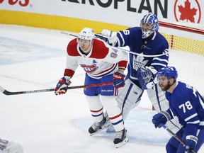Maple Leafs goalie Jack Campbell gives Canadiens forward Corey Perry a shove during a game on May 6. The Toronto-Montreal series gets underway on Thursday.