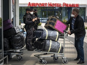 Employees of the Russian embassy in Prague and their families arrive to board a Russian government plane along with expelled diplomats at Vaclav Havel Airport on May 29, 2021 in Prague, Czech Republic.