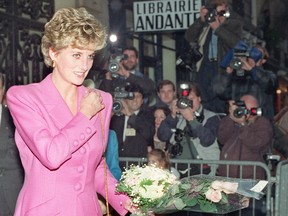 In this file photo taken on November 14, 1992 Princess Diana leaves a bookshop in Paris.
