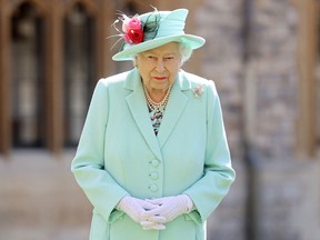 In this file photo taken on July 17, 2020 Queen Elizabeth II poses at Windsor Castle in Windsor, west of London.