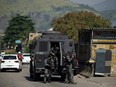 Rio's Civil Police officers are seen during a police operation agains drug traffickers at the Jacarezinho favela in Rio de Janeiro state, Brazil, on May 6, 2021.