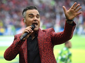 English musician Robbie Williams performs during the World Cup opening ceremony on June 14, 2018 at Moscows Luzhniki Stadium.