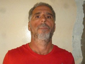 Handout file photo taken on September 5, 2017, showing Italian Rocco Morabito, wanted for more than 20 years for drug trafficking and mafia activities, during his arrest in Montevideo.