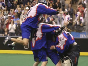 Members of the Toronto Rock celebrate after winning the 2011 NLL title at the then Air Canada Centre.