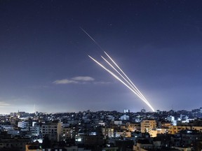 Rockets are launched towards Israel from Gaza City, controlled by the Palestinian Hamas movement, on  Tuesday, May 18, 2021. Heavy air strikes and rocket fire in the Israel-Gaza conflict claimed more lives on both sides as tensions flared in Palestinian "day of anger" protests in Jerusalem and the West Bank.