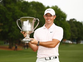 Rory McIlroy poses with the trophy after winning  the Wells Fargo Championship at Quail Hollow Club on Sunday in Charlotte, N.C.