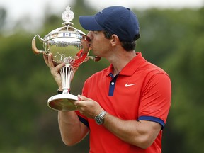Rory McIlroy poses for a photo with the trophy after winning the RBC Canadian Open at Hamilton Golf and Country Club on June 9, 2019 in Hamilton.