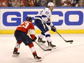 Lightning defenceman Ryan McDonagh (right) controls the puck around Panthers centre Carter Verhaeghe (left) in Game 5 of the first round of the 2021 Stanley Cup Playoffs at BB&T Center, in Sunrise, Fla., Monday, May 24, 2021.