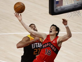 Toronto Raptors forward Yuta Watanabe (18) and Utah Jazz centre Rudy Gobert (27) battle for the rebound in the first quarter at Vivint Arena in Salt Lake City on May 1, 2021.