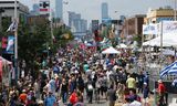 Crowds take in Taste of the Danforth on Danforth Ave. in Toronto on August 12, 2017. 