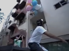 An Indian man tied balloons to his dog to try to get it to fly.