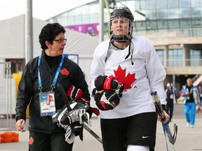 Danielle Goyette (left) and Hayley Wickenheiser walk through the Olympic Park in Sochi, Russia in a 2014 photo. Goyette is joining Wickenheiser on the staff of the Toronto Maple Leafs.