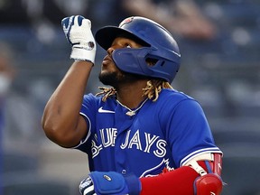 Vladimir Guerrero Jr.  of the Toronto Blue Jays reacts after hitting a two-run home run against the New York Yankees on May 25, 2021.