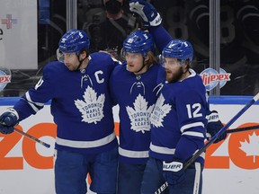 Toronto Maple Leafs forward William Nylander (centre) celebrates with forward John Tavares (left) and forward Alex Galchenyuk earlier this month.
