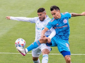 Toronto FC midfielder Alejandro Pozuelo (left) and Columbus Crew SC midfielder Lucas Zelarayan fight for the ball during their game at Historic Crew Stadium Saturday. USA TODAY SPORTS