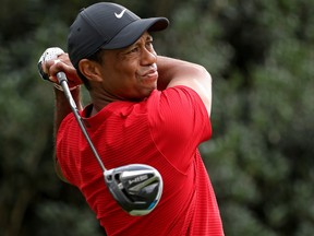 Tiger Woods plays his shot from the 15th tee during the final round of the Masters at Augusta National Golf Club on November 15, 2020 in Augusta, Georgia.