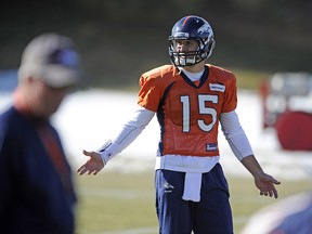 Denver Broncos quarterback Tim Tebow (15) warms up during a practice session being held at Broncos Training Facility.