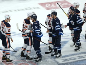 The handshake line after the Winnipeg Jets swept the Edmonton Oilers in a best-of-seven Stanley Cup playoff series in Winnipeg on Monday, May 24, 2021.