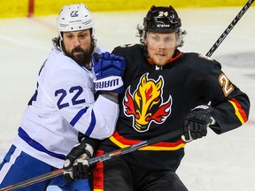 Toronto Maple Leafs defenceman Zach Bogosian battles against Brett Ritchie of the Calgary Flames during NHL hockey in Calgary on Monday April 5, 2021.