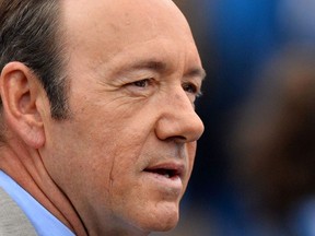 In this file photo taken on June 12, 2013 US actor Kevin Spacey watches as France's Nicolas Mahut plays Scotland's Andy Murray during their ATP Aegon Championships tennis match at the Queen's Club in west London.