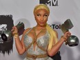 In this file photo taken on November 04, 2018 Trinidadian-US rapper Nicki Minaj poses backstage with her awards during the MTV Europe Music Awards at the Bizkaia Arena in the northern Spanish city of Bilbao.