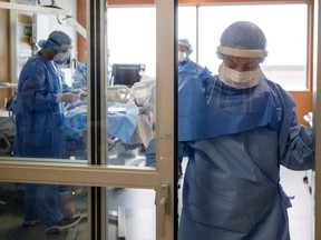 Angela Bedard, a nurse re-assigned to the Intensive Care Unit, stands in a doorway after helping to intubate a patient suffering from COVID-19 at Humber River Hospital's ICU, in Toronto on April 28, 2021.