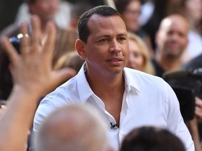 In this file photo taken on August 2, 2018 US former professional baseball player Alex Rodriguez greets fans after Keith Urban performs on NBC's 'Today Show' at Rockefeller Plaza in New York City.