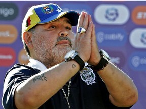 In this file photo taken on November 02, 2019 Gimnasia y Esgrima team coach Diego Armando Maradona gestures to supporters as he leaves the field after an Argentina First Division Superliga football match against Estudiantes, at El Bosque stadium, in La Plata, Buenos Aires province, Argentina.