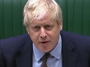 A video grab from footage broadcast by the UK Parliament's Parliamentary Recording Unit (PRU) shows Britain's Prime Minister Boris Johnson speaking during Prime Minister's Question time (PMQs) in the House of Commons in London on May 26, 2021.