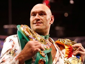 Boxing - Deontay Wilder v Tyson Fury - WBC Heavyweight Title - The Grand Garden Arena at MGM Grand, Las Vegas, United States - February 22, 2020 Tyson Fury poses with his belts during a press conference after the fight.