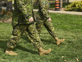 Military health-care personnel prepare for patients at a mobile health unit at Sunnybrook Hospital during the COVID-19 pandemic in Toronto on Tuesday, April 27, 2021.