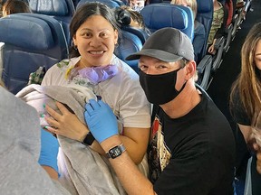 New mom Lavinia “Lavi” Mounga with Dr. Dale Glenn aboard the Delta flight where she delivered little Raymond.
