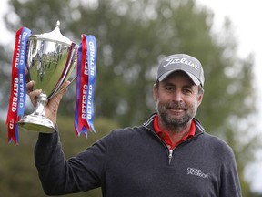 Golf - European Tour - British Masters - The Belfry, Sutton Coldfield, Britain - May 15, 2021 England's Richard Bland celebrates winning the British Masters with the trophy.