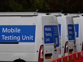 Coronavirus disease (COVID-19) mobile testing vehicles are seen parked at a depot in London, Britain, May 3, 2021.